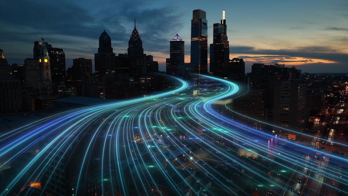 A futuristic smart city at night with connected light networks representing digital growth and automation